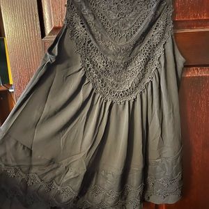 Black with lace sleeveless blouse.